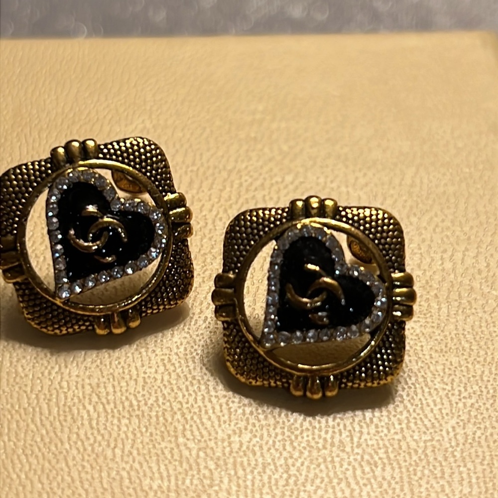 Woman old stylish  classy style Chanel symbol on square earrings